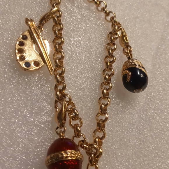 Faberge egg charm bracelet on a gold tone rolo chain. - Picture 5 of 16